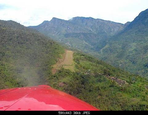 Final approach into Pamek. This strip was about 1600' long with about 15% slope and a little side slope. It was narrow with a rock wall on the left...
