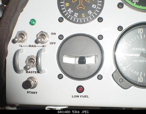 Left panel side....low fuel indicator.....master switch guard...master switch green light indicator