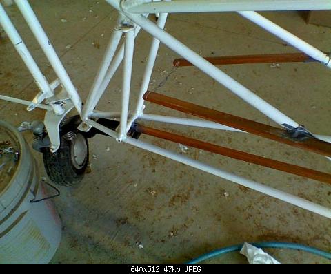 April 10: Rear of lower stringer rests in a pocket in front of the tail spring bolt tube.